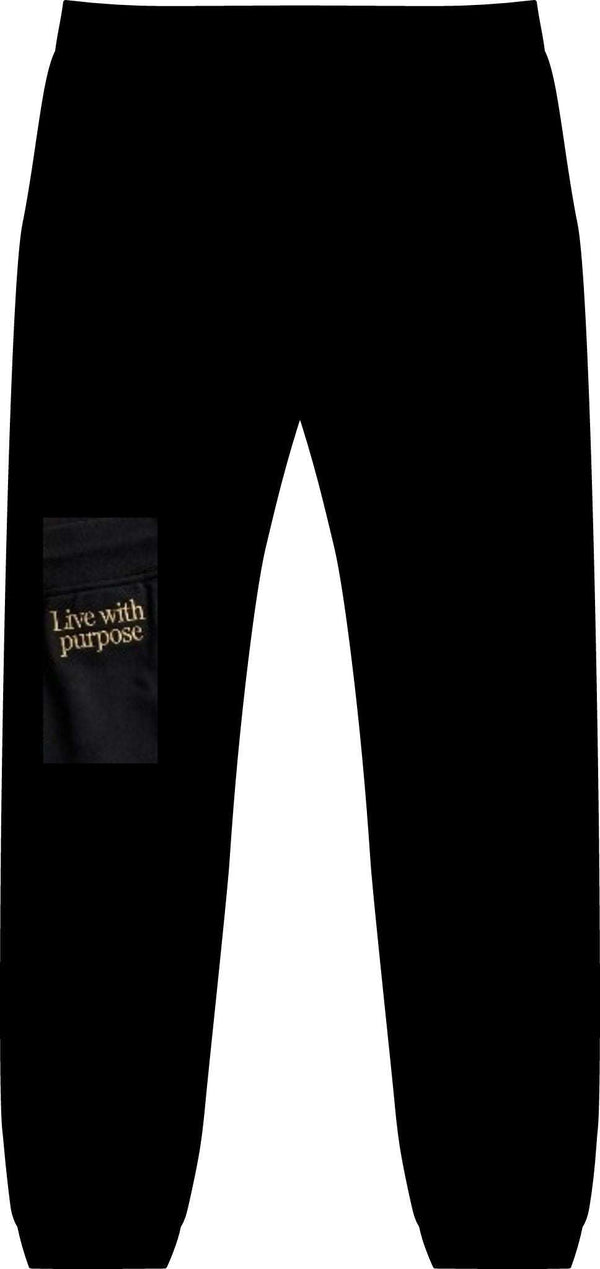 Black joggers featuring a minimalist design with the phrase "Live with purpose" printed on one leg in gold lettering.
